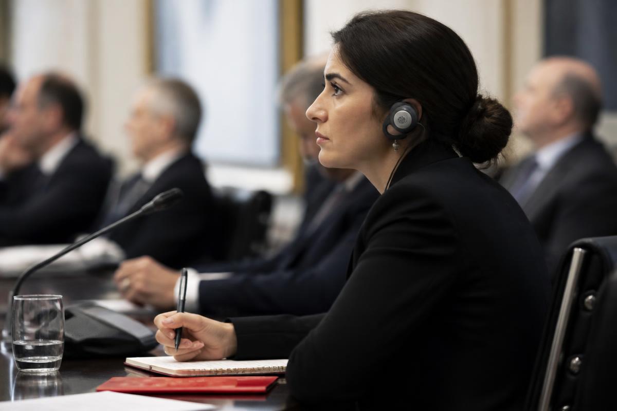 Professional interpreter wearing a headset during a business conference